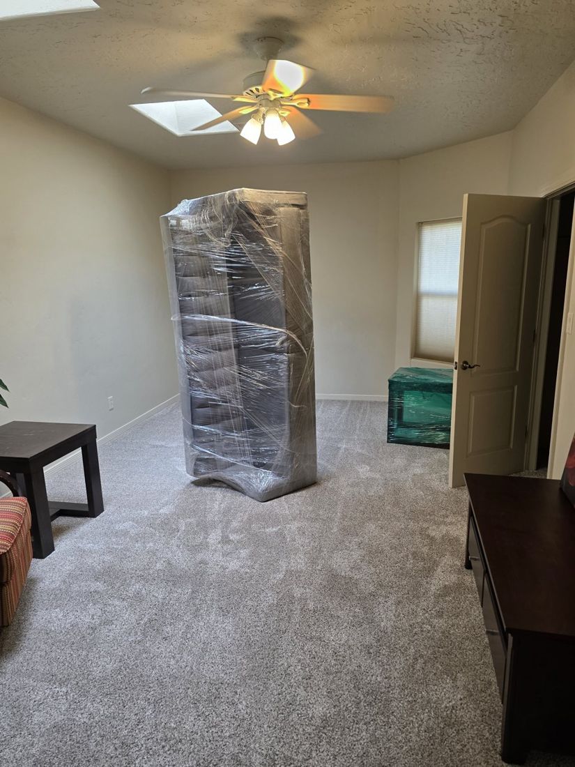Wrapped cabinet and bins during home staging setup