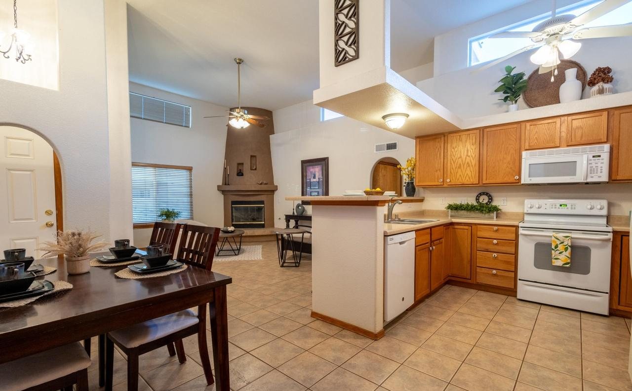 Staged dining table set for dinner beside the kitchen, Foxtail Pine Las Cruces