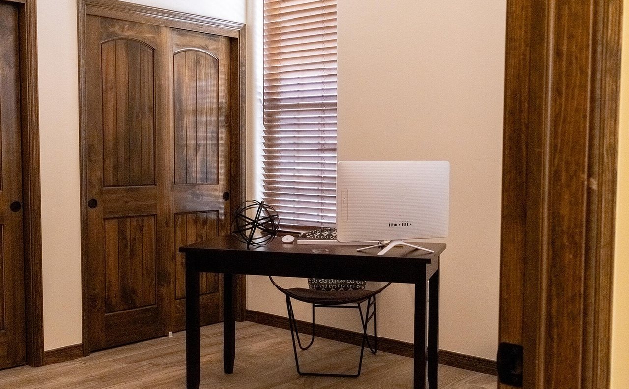 Staged home office with desk and chair, Sedona Boulders home staging Las Cruces