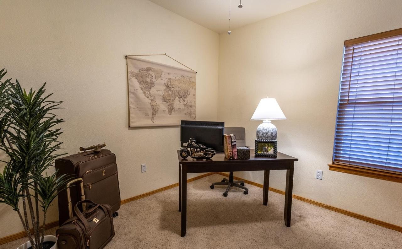 Staged home office with desk, lamp and plant, Foxtail Pine home staging Las Cruces