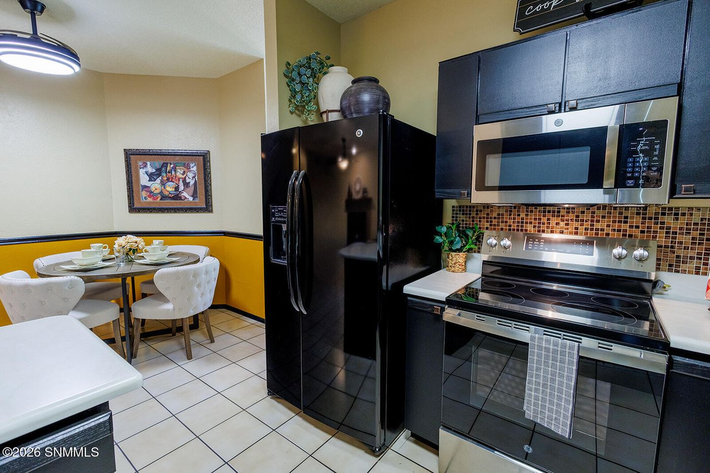Staged kitchen with dark cabinetry and styled counters, Las Cruces NM home staging