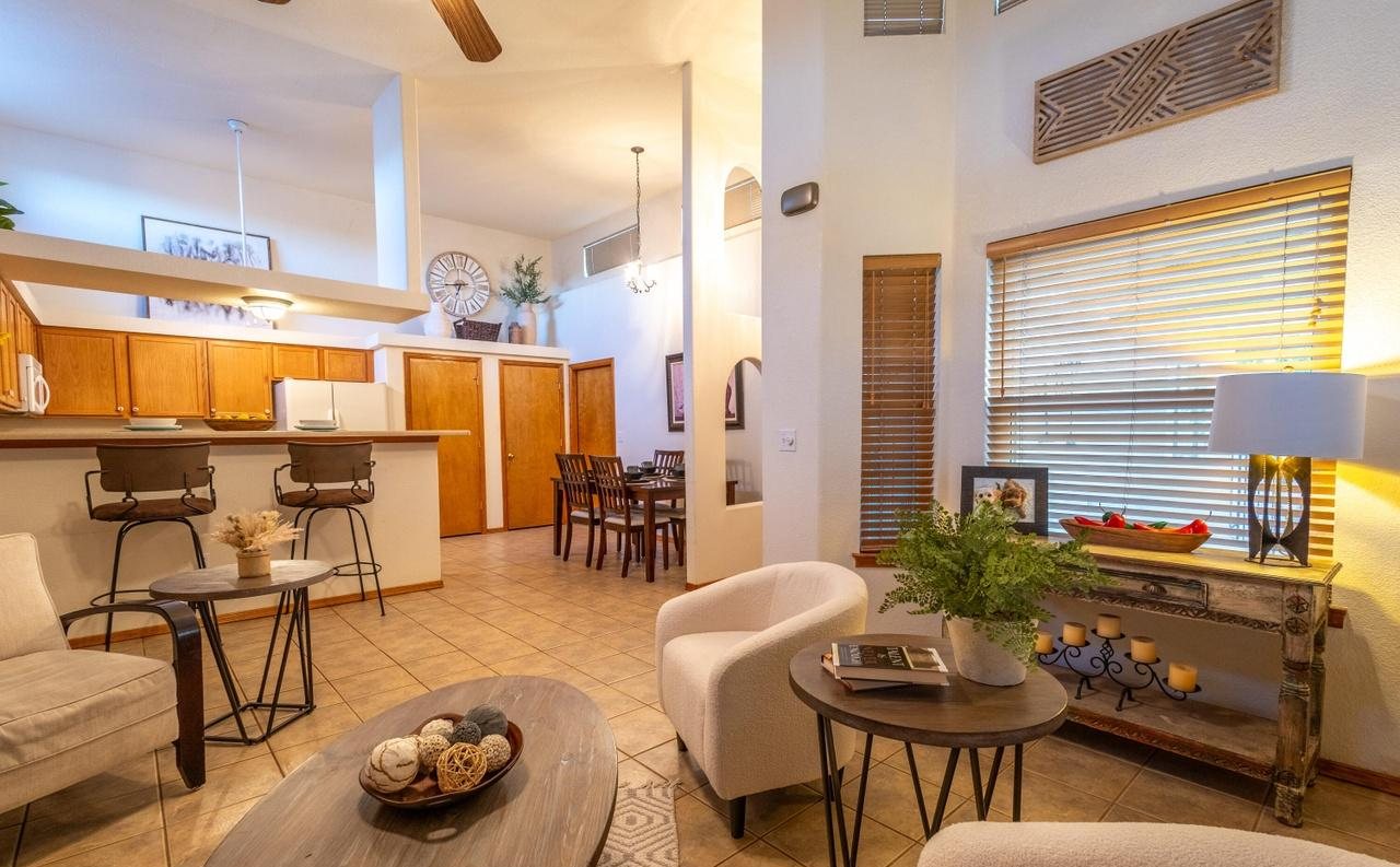 Staged living room opening to the kitchen and bar stools, Foxtail Pine Las Cruces