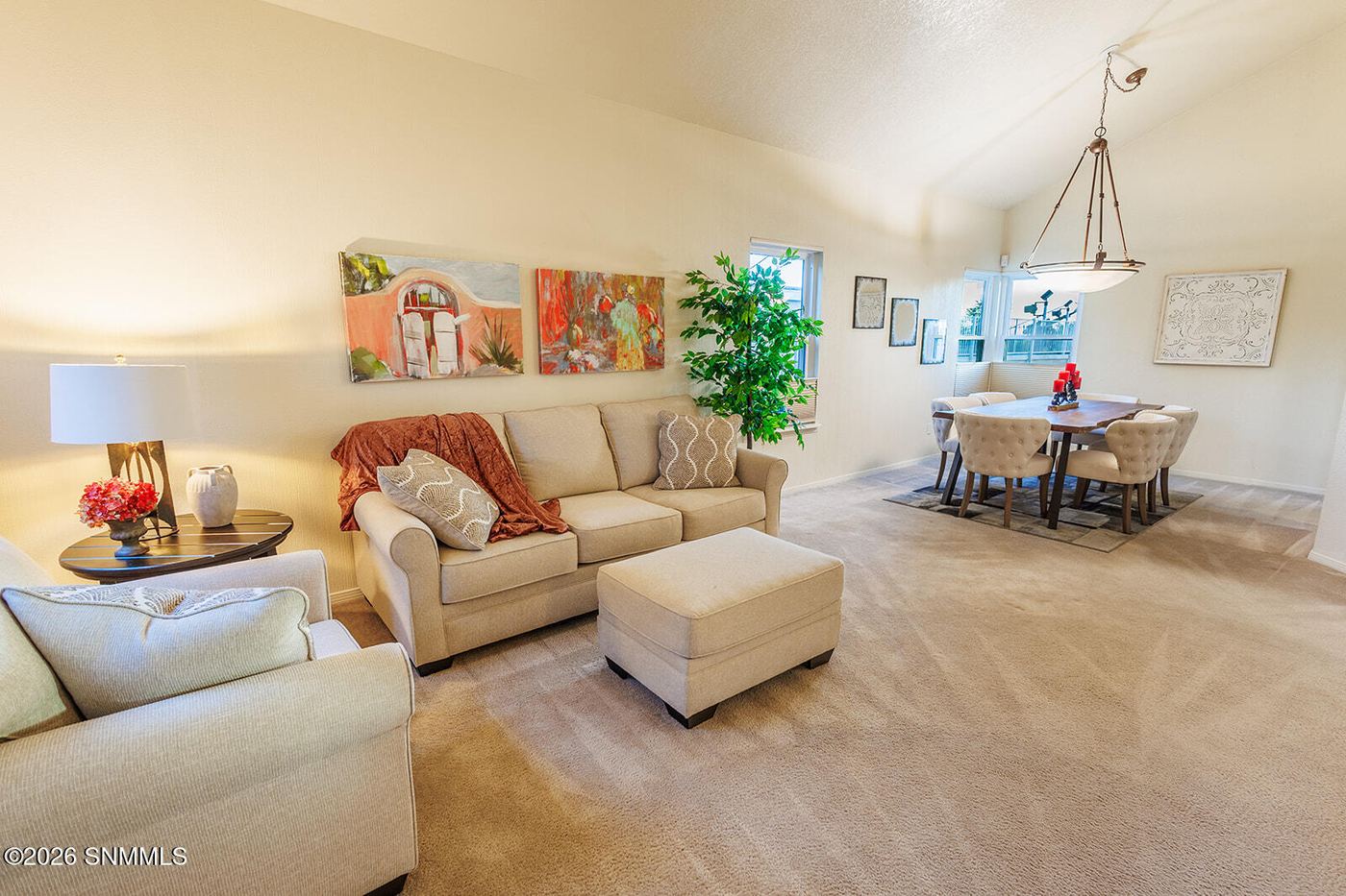 Staged living room with sectional sofa in a Las Cruces home staged by Sherri' Harrison Designs