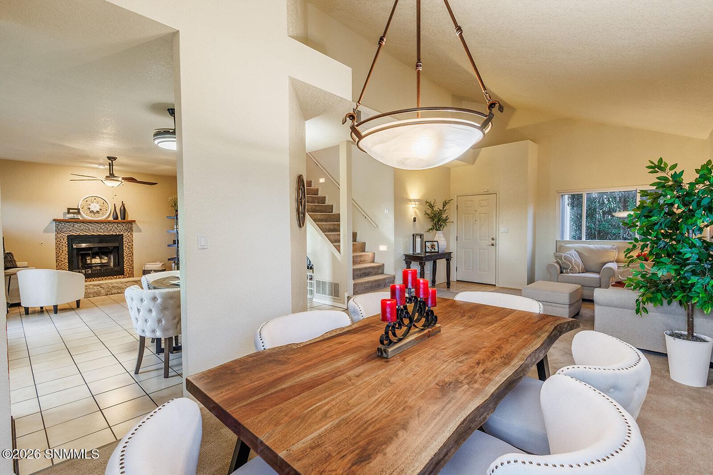 Open floor plan dining and living area fully staged with real furniture in Las Cruces