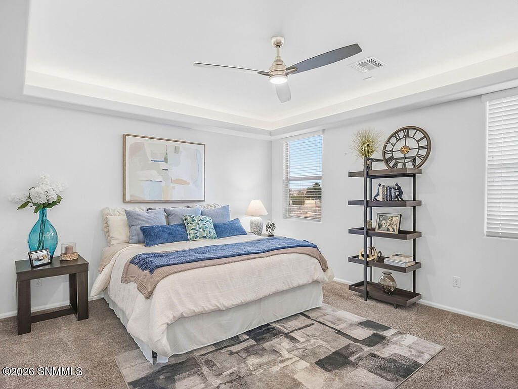 Staged primary bedroom with real bed, rug and shelving, Villa Napoli Las Cruces
