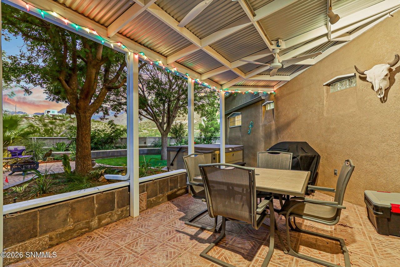 Covered patio with outdoor dining set overlooking the yard, Black Quartz Road Las Cruces