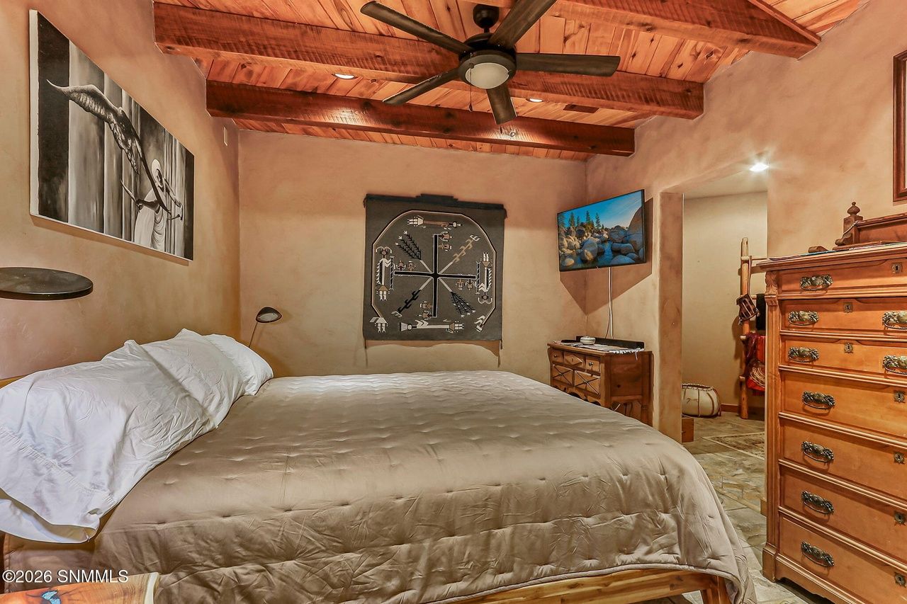 Bedroom with wood beam ceiling and real bed, Black Quartz Road Las Cruces
